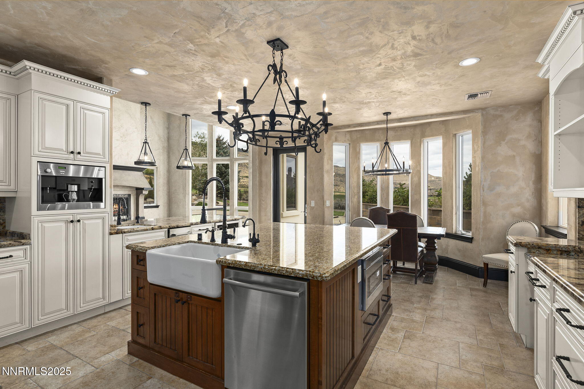 3653 Spirit Bluff Court Reno, NV 89511 - Photo 14 of 46 a kitchen with stainless steel appliances granite countertop a sink and a refrigerator