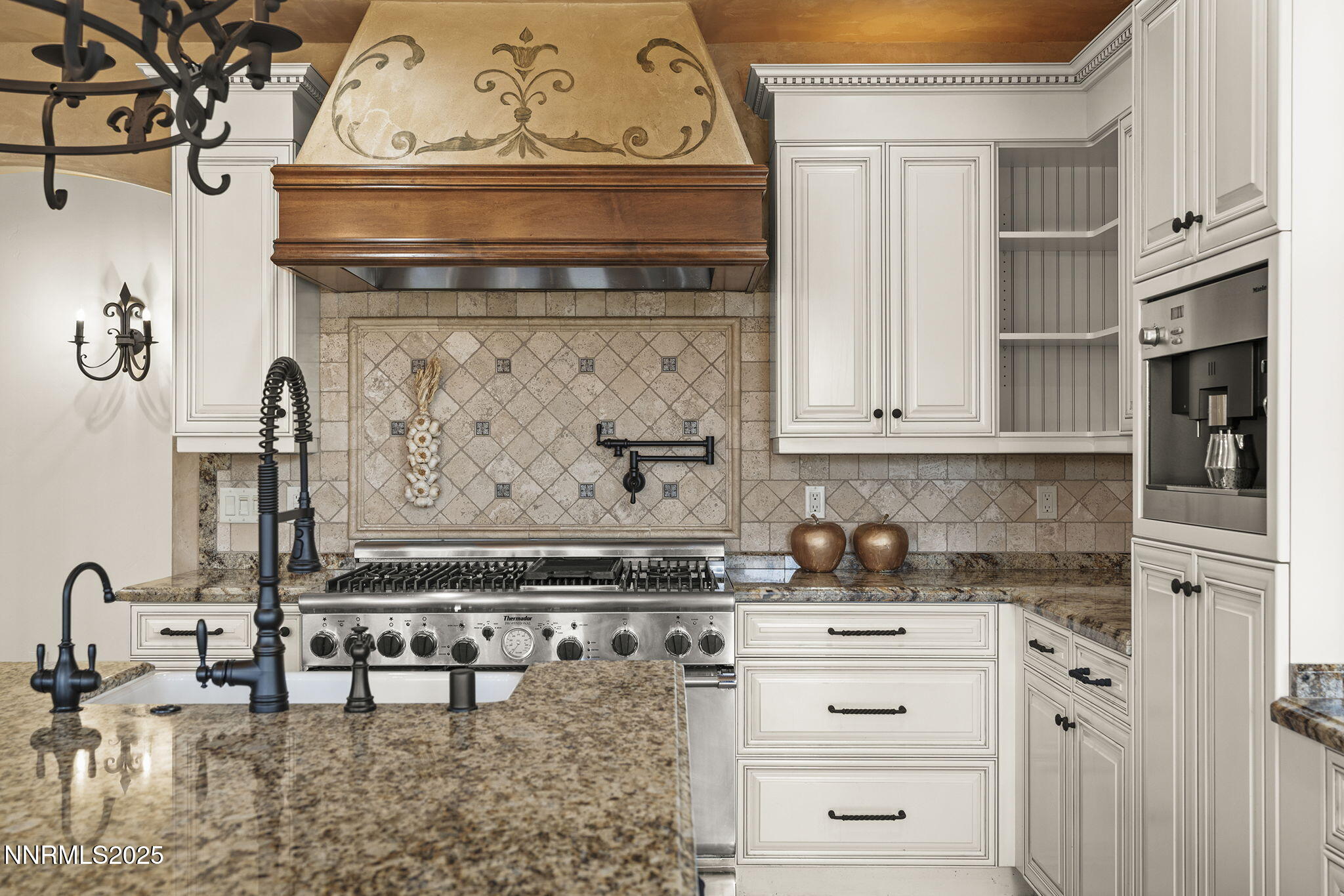 3653 Spirit Bluff Court Reno, NV 89511 - Photo 16 of 46 a kitchen with stainless steel appliances granite countertop a stove and a cabinets