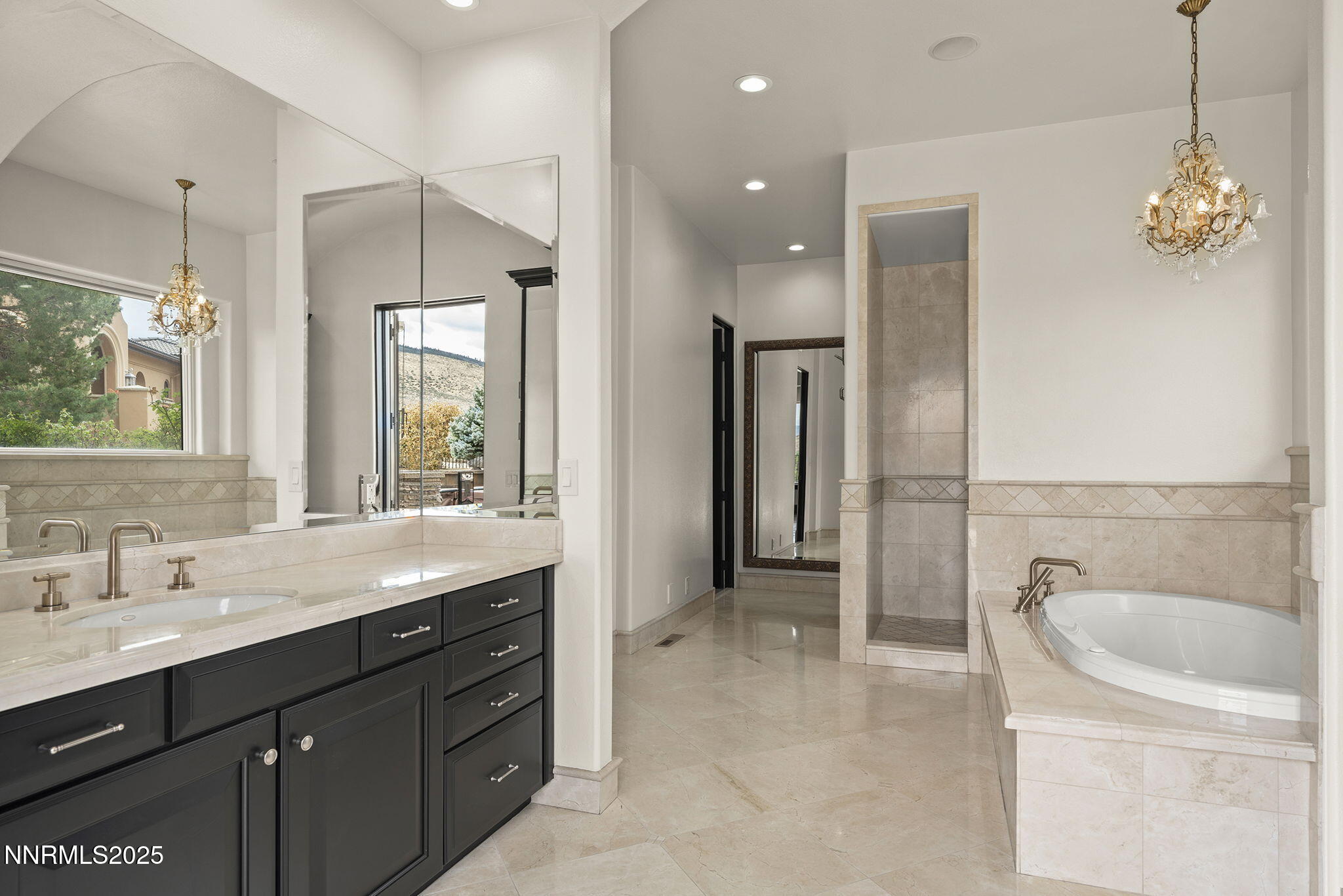 3653 Spirit Bluff Court Reno, NV 89511 - Photo 24 of 46 a spacious bathroom with a shower sink and mirror