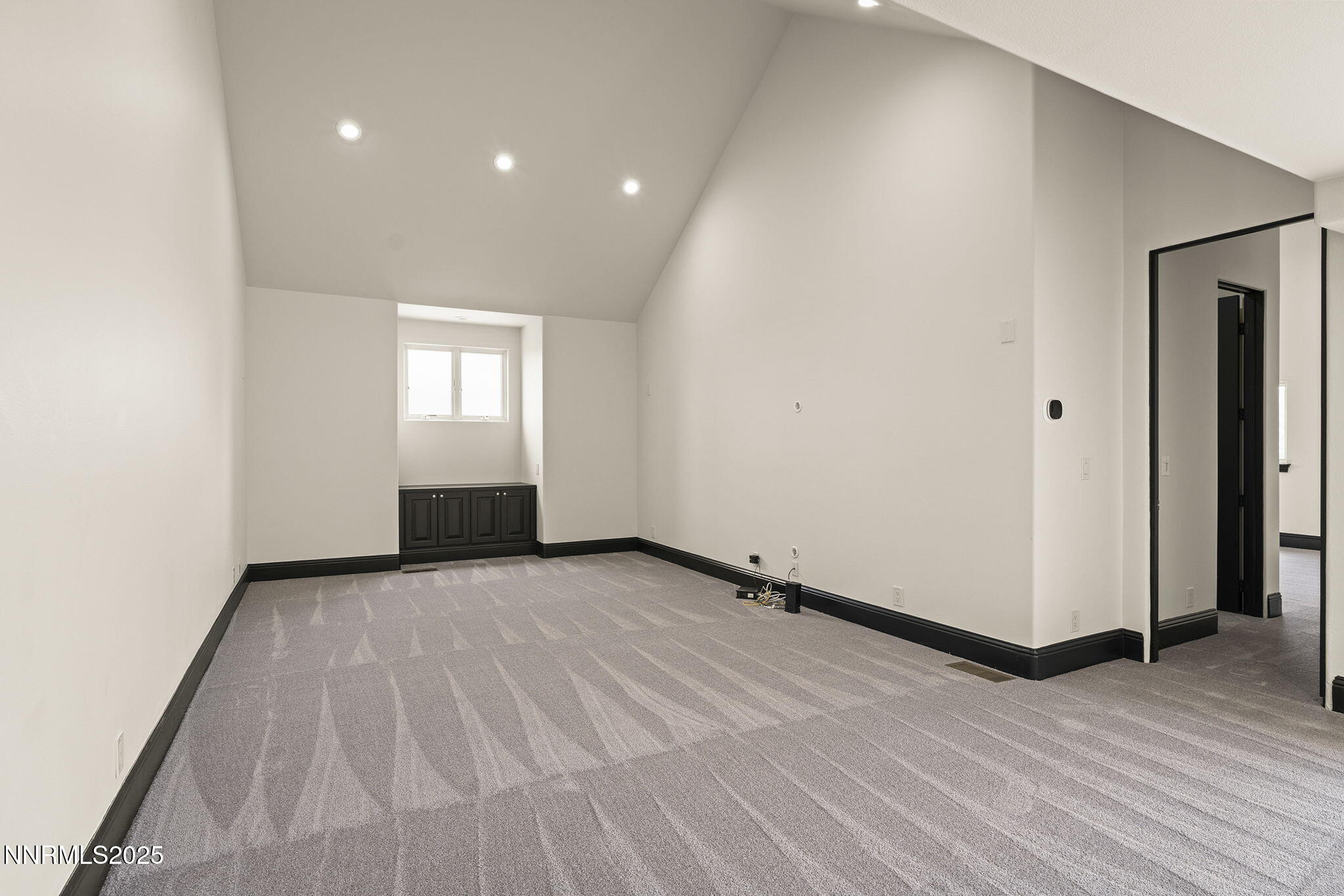 3653 Spirit Bluff Court Reno, NV 89511 - Photo 36 of 46 an empty room with wooden floor and windows