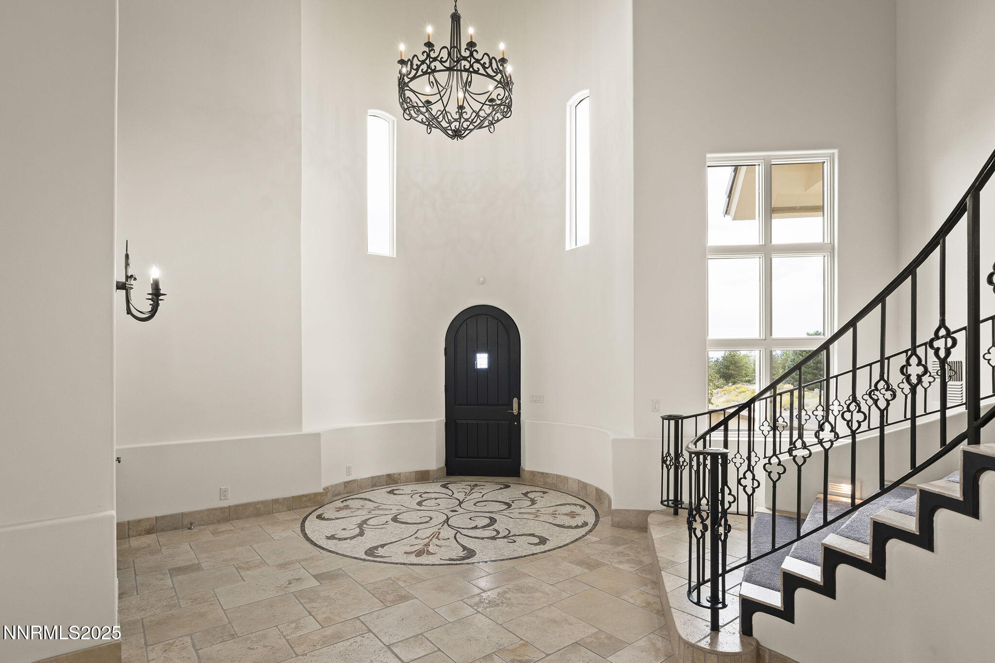 3653 Spirit Bluff Court Reno, NV 89511 - Photo 9 of 46 a view of a hallway with wooden floor and a chandelier