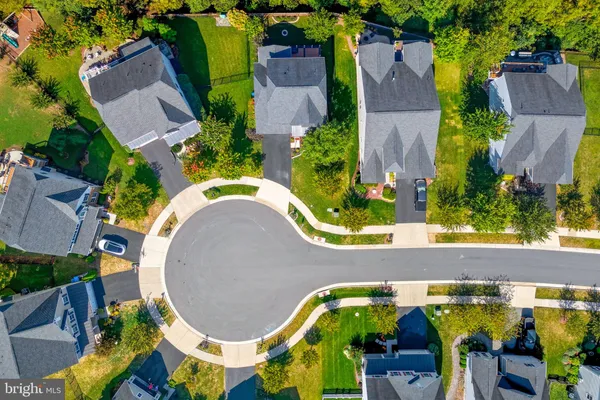 a picture of a room with a white wall and a refrigerator