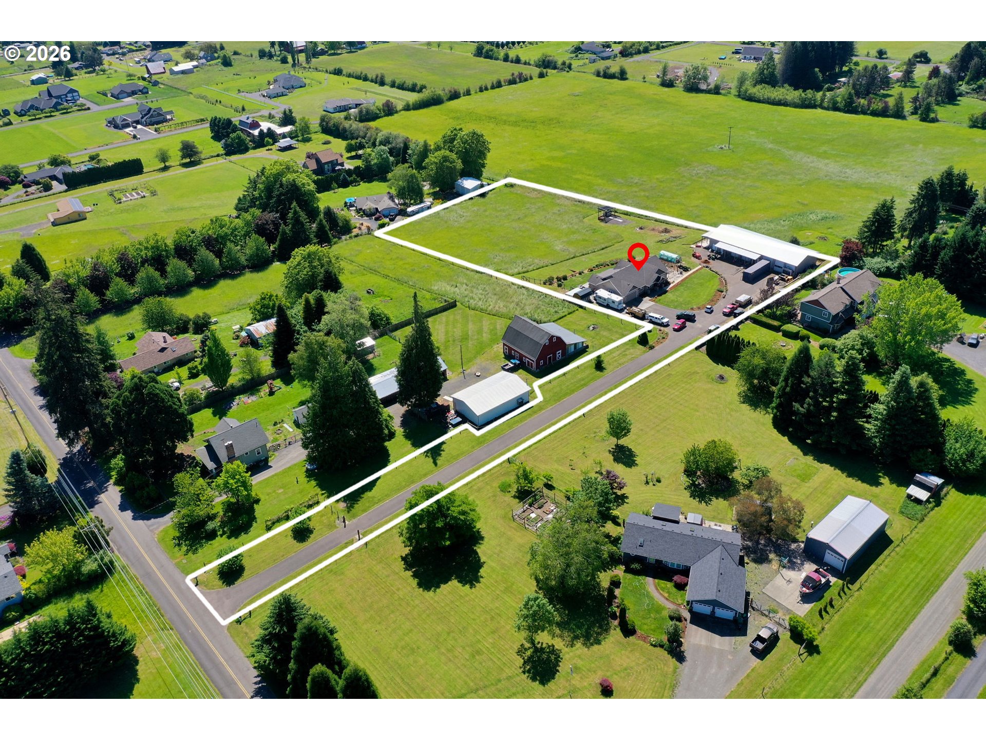 33058 Church Road Warren, OR 97053 - Photo 5 of 45 an aerial view of a tennis ground and a yard