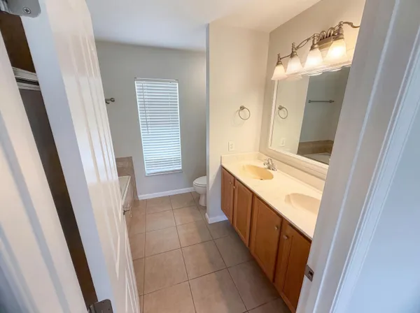 a bathroom with a sink a toilet and a tub