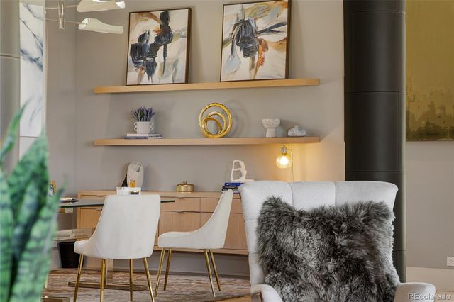 a bed room with a bed and chair