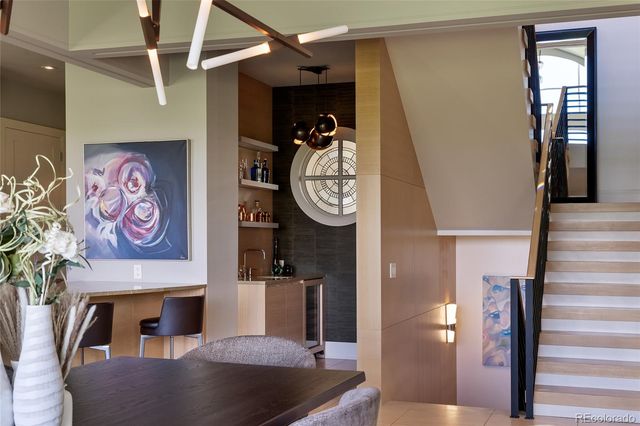 a view of a hallway with paintings on the wall