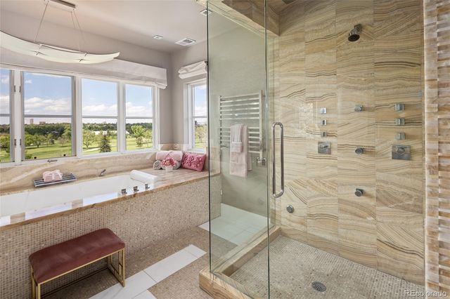 a view of bathroom with a tub shower and sink