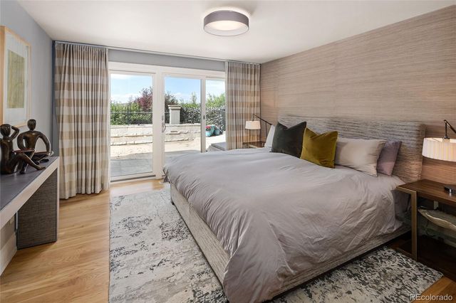 a bathroom with a tub shower and checkered floor