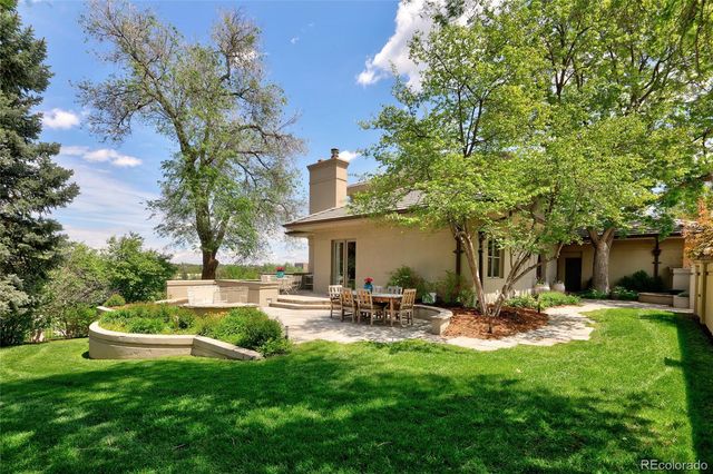 a view of a big yard with a fountain