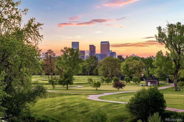 a view of a dining room with a table and chairs