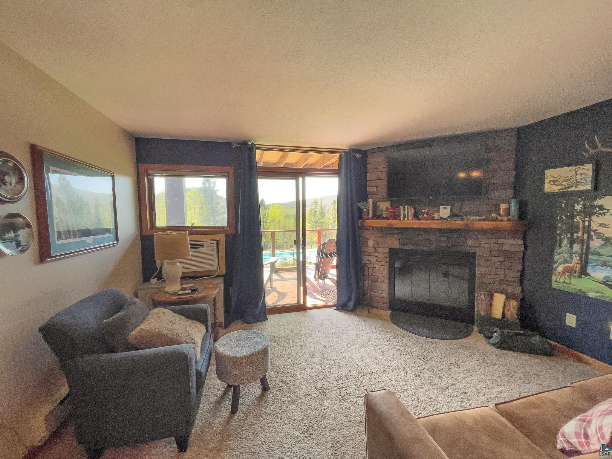 124 B Bridge Run Lane, Unit B Lutsen, MN 55612 - Photo 4 of 31 Enjoy views of the Mountain and comforts of the fireplace