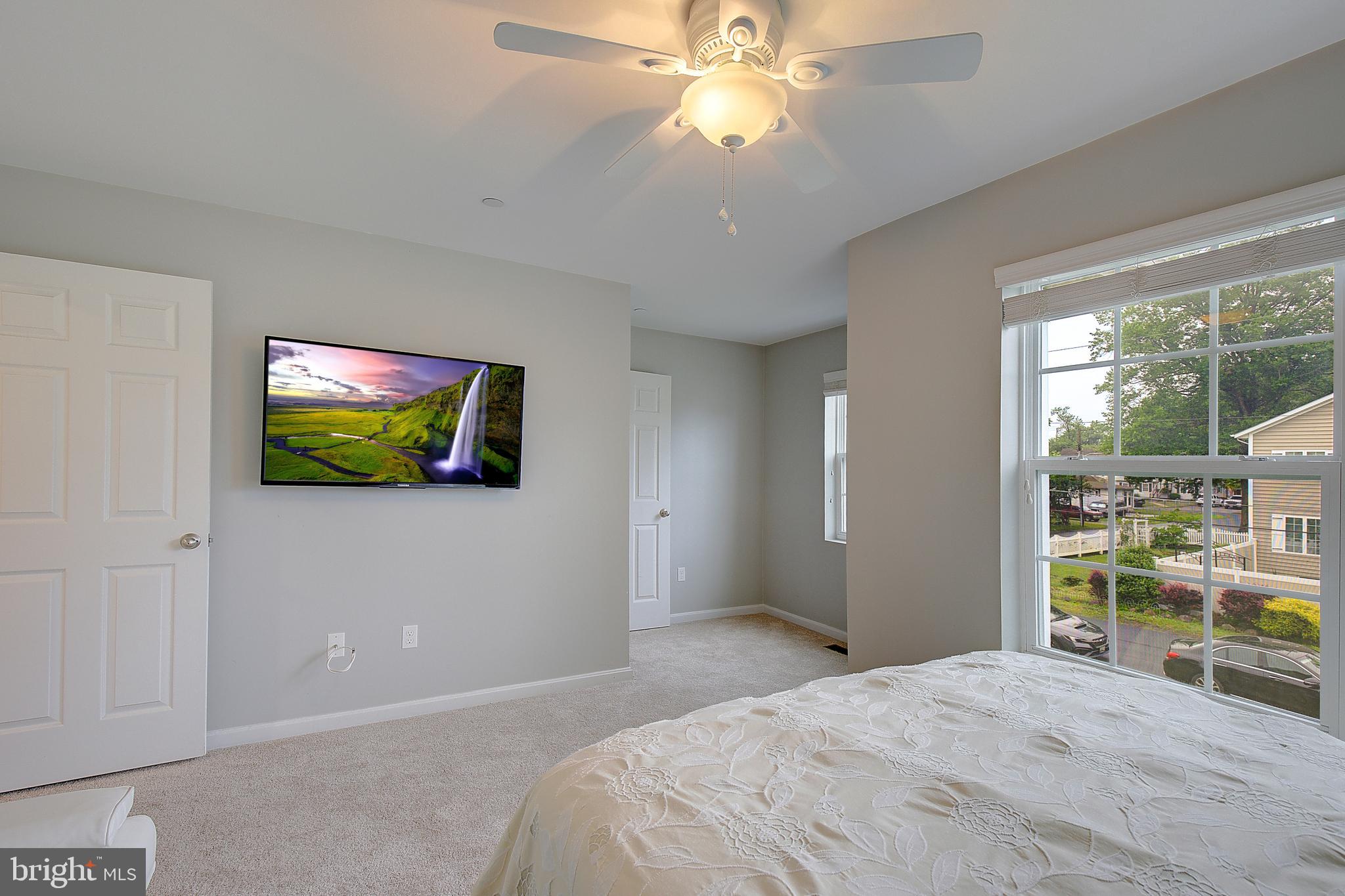 403 Venton Road Edgewater, MD 21037 - Photo 39 of 62 a bedroom with a bed and a flat screen tv