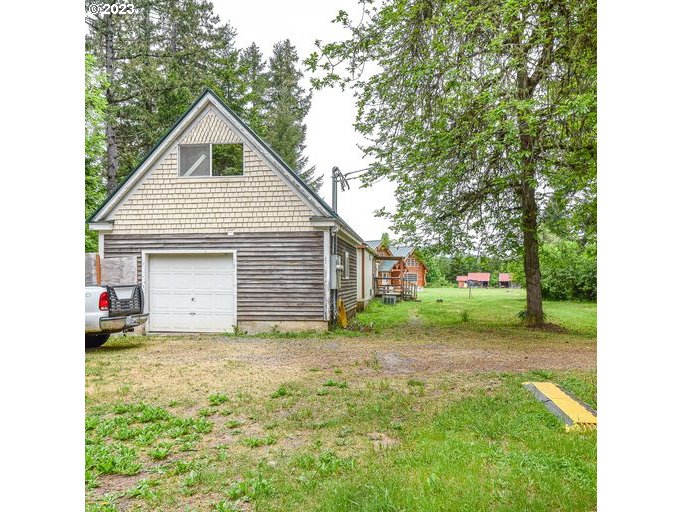 72717 London Road Cottage Grove, OR 97424 - Photo 33 of 41 a view of a house with yard and tree s