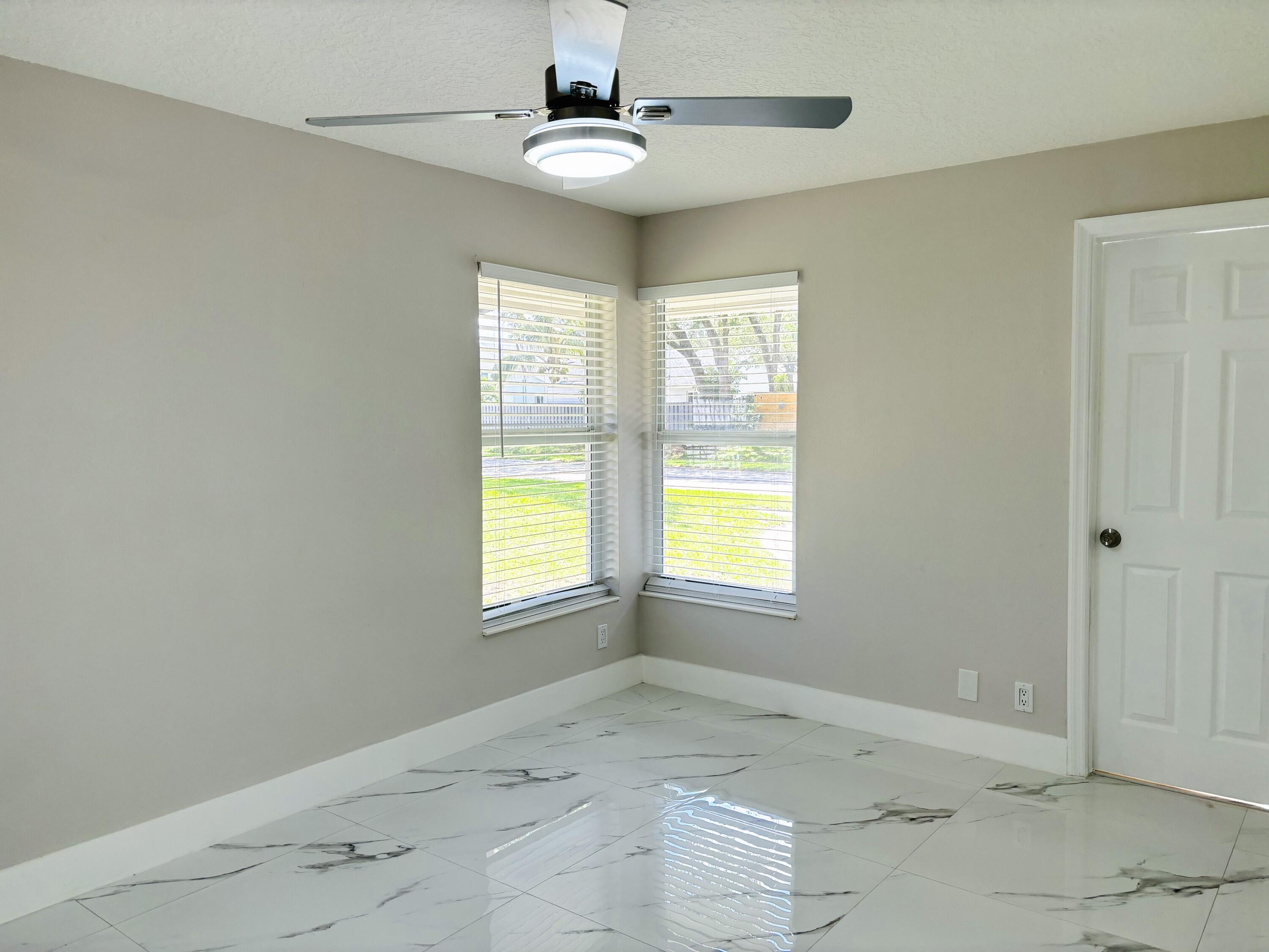 1341 West Royal Palm Road Boca Raton, FL 33486 - Photo 12 of 19 a view of an empty room with a window