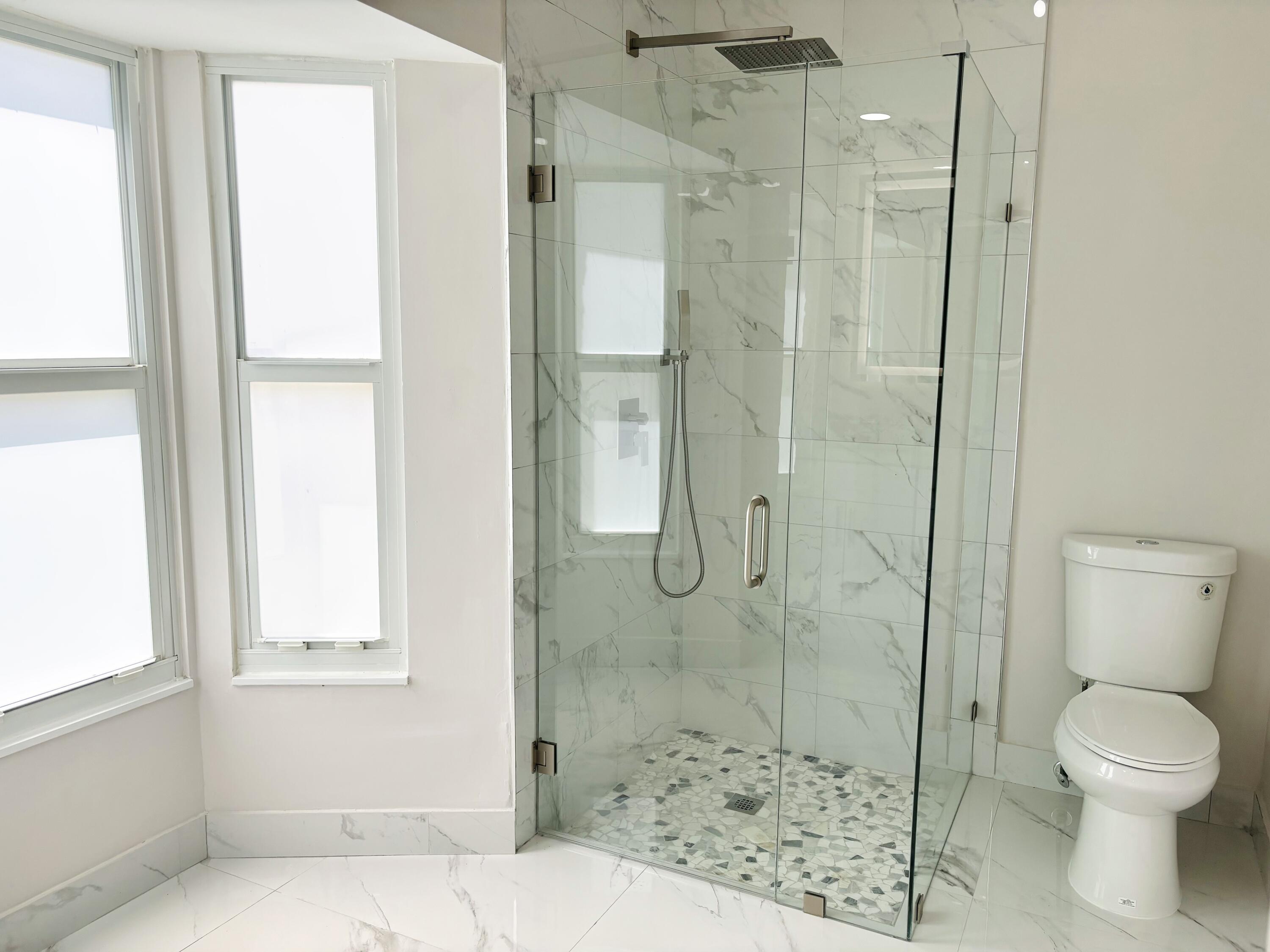 1341 West Royal Palm Road Boca Raton, FL 33486 - Photo 16 of 19 a bathroom with a shower and toilet