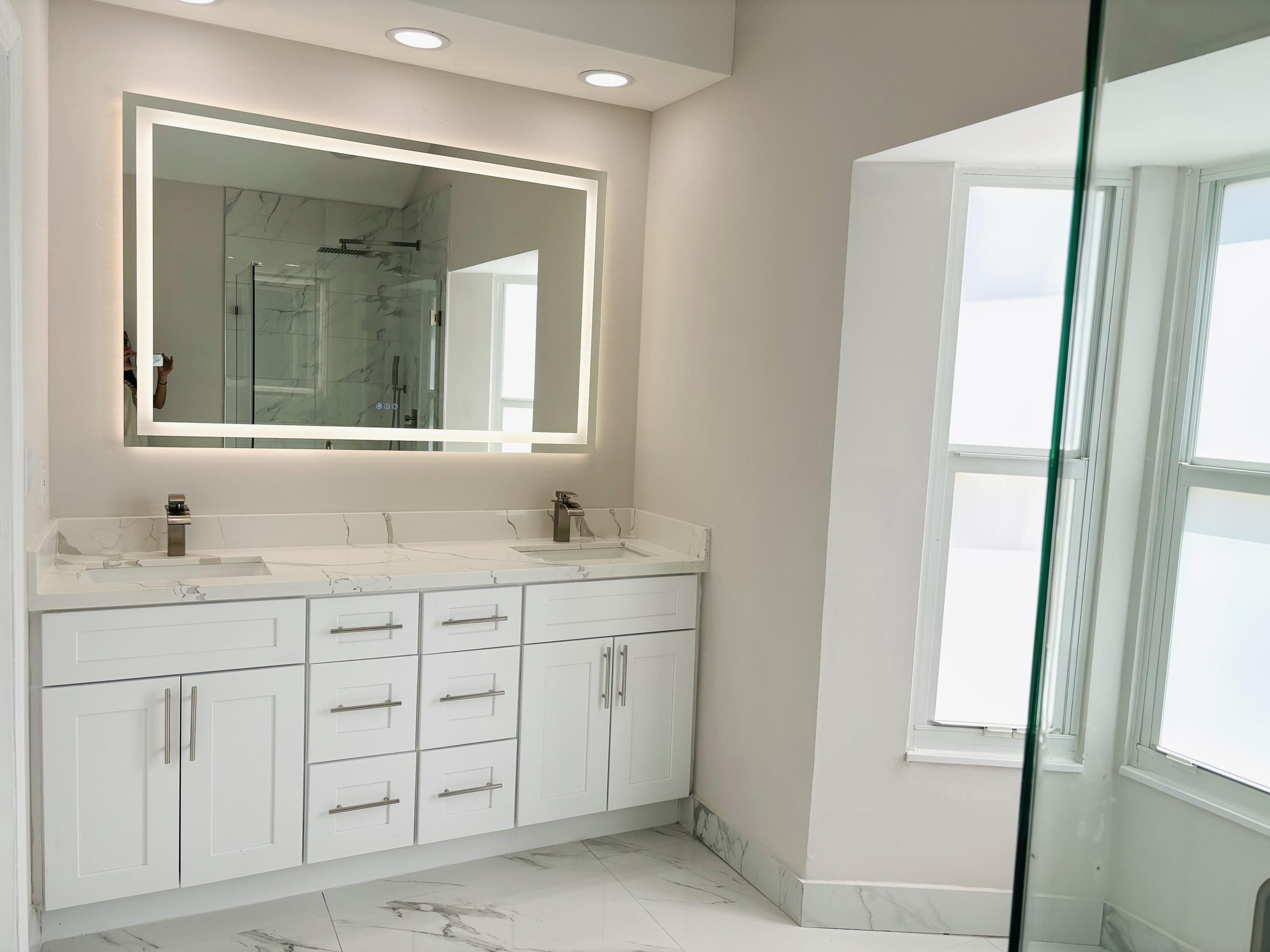 1341 West Royal Palm Road Boca Raton, FL 33486 - Photo 17 of 19 a bathroom with a granite countertop sink and a mirror