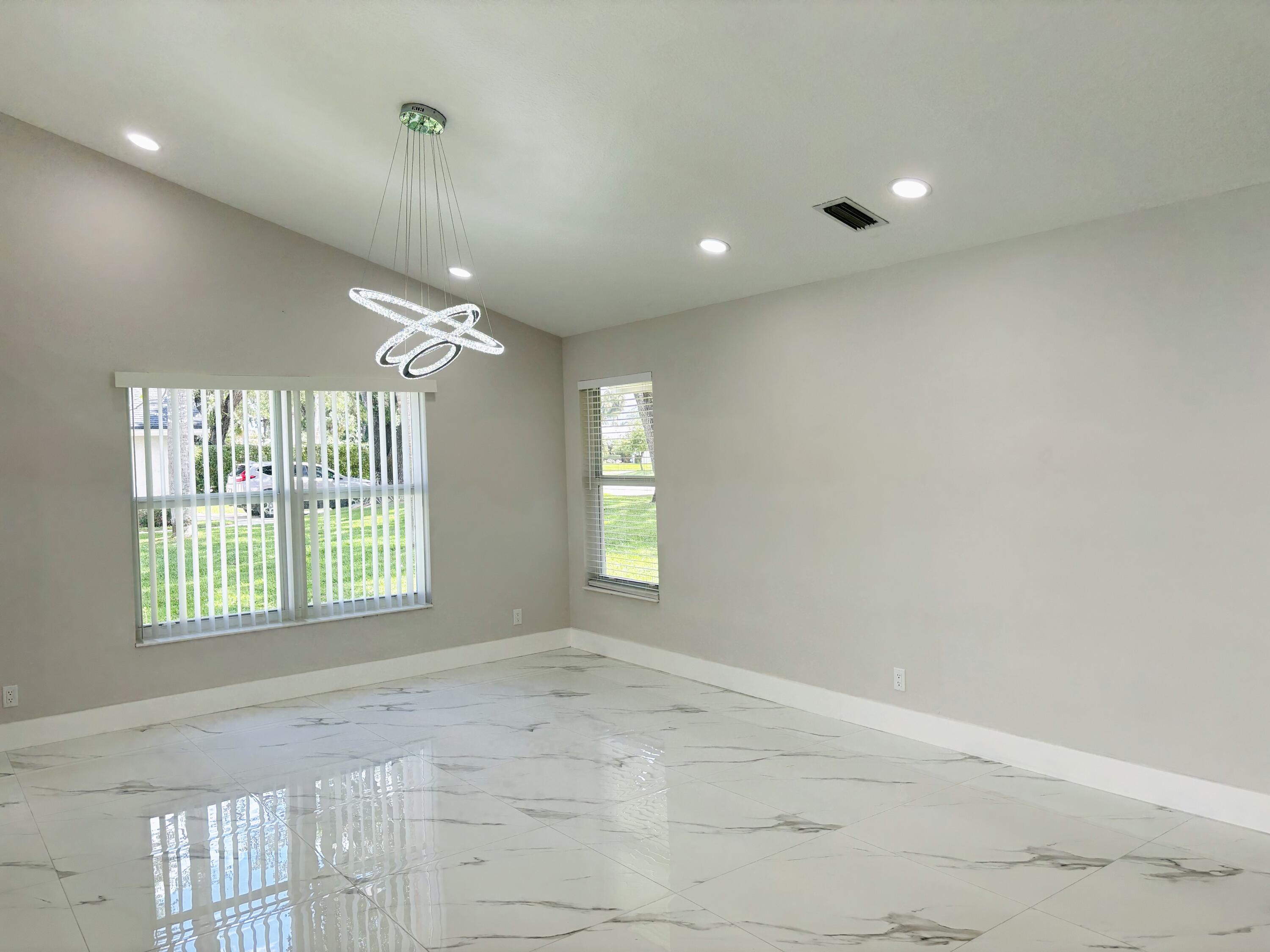 1341 West Royal Palm Road Boca Raton, FL 33486 - Photo 6 of 19 a view of an empty room with a window