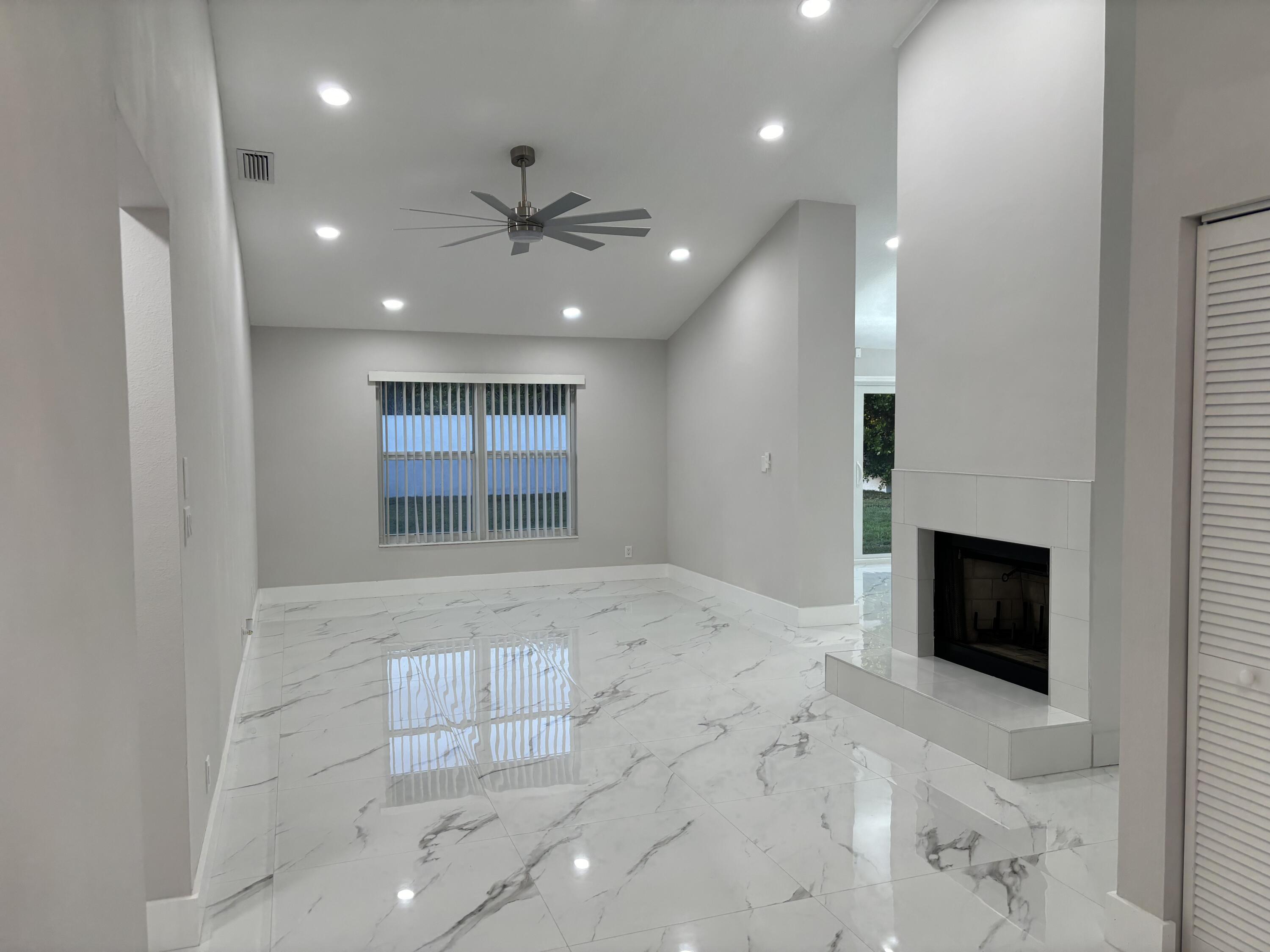 1341 West Royal Palm Road Boca Raton, FL 33486 - Photo 8 of 19 a view of an empty room with a fireplace