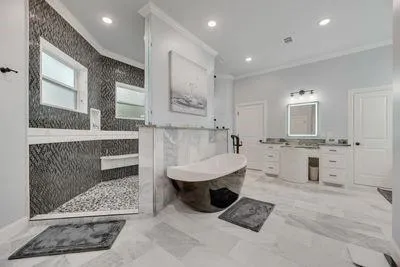 a view of a dining room with furniture and a chandelier