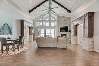 a spacious bathroom with a double vanity sink a mirror and a bathtub