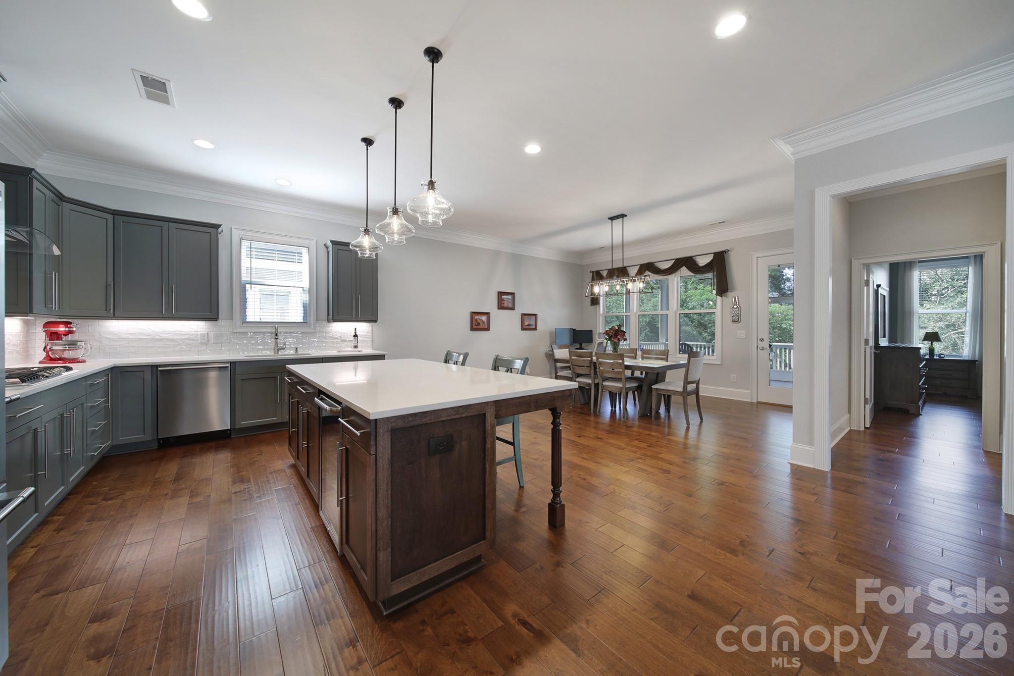 1633 Half Pint Loop Fort Mill, SC 29708 - Photo 10 of 48 a kitchen with a sink cabinets and wooden floor