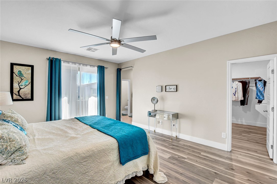 9688 Rankin Rdg Court Las Vegas, NV 89178 - Photo 34 of 53 Relax in this well-lit primary bedroom featuring a large window and ample storage.