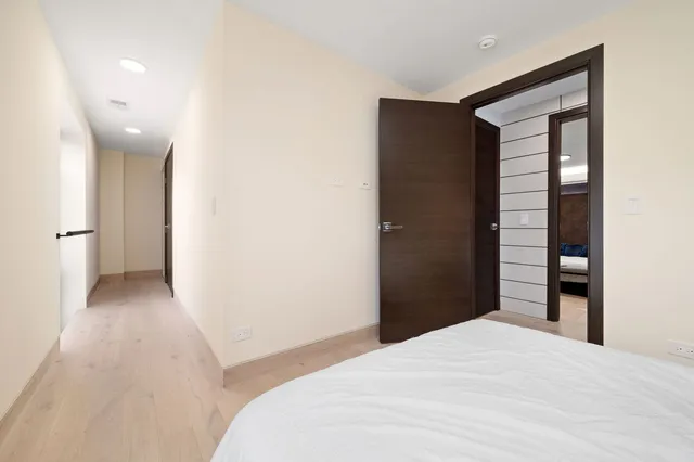 a bedroom with a bed and bathroom