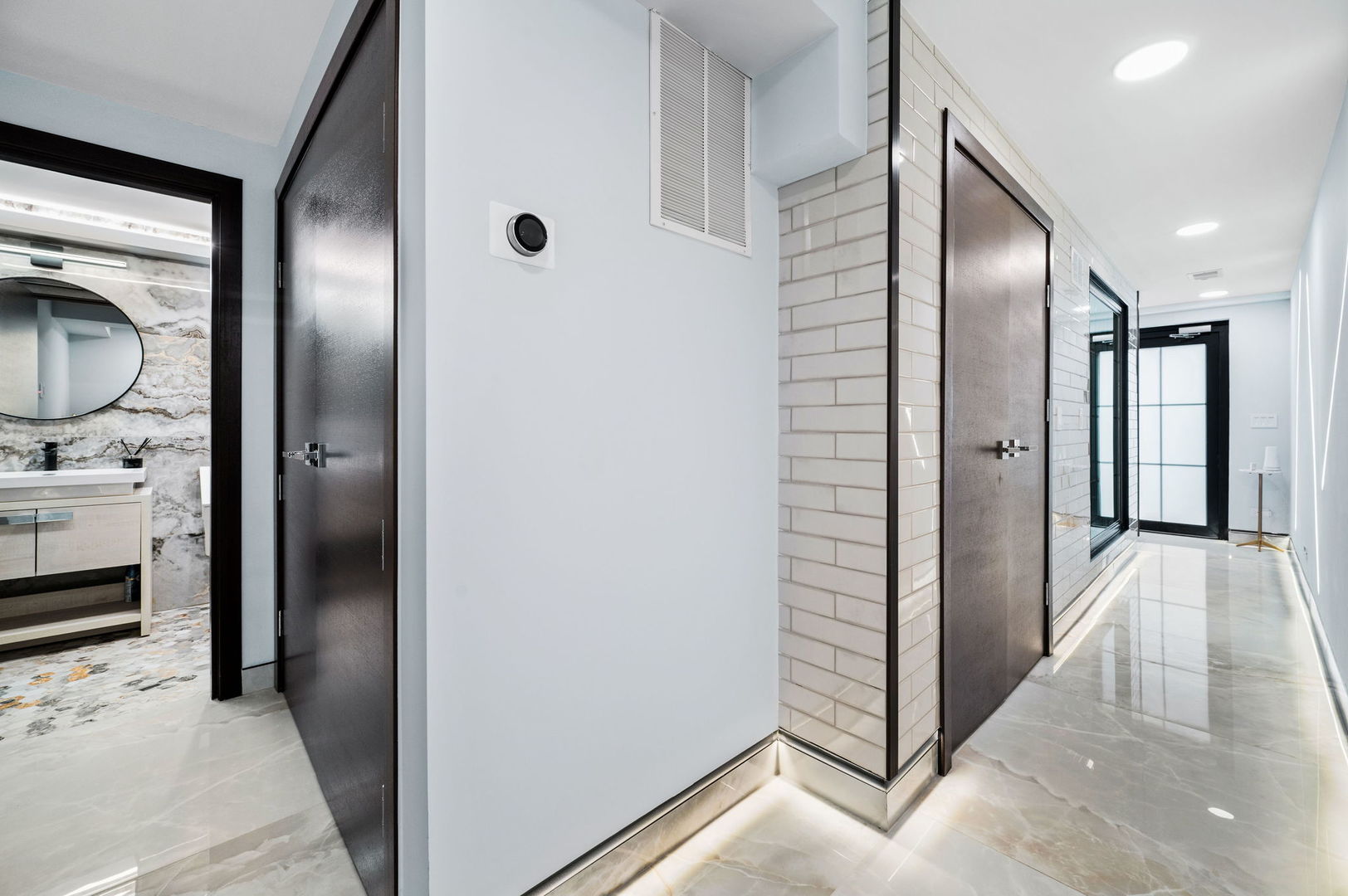 3024 West Irving Park Road, Unit 1S Chicago, IL 60618 - Photo 23 of 44 a view of hallway with walk in closet and wooden floor