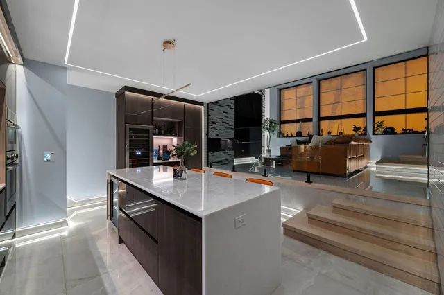 a room with patio furniture and a large window