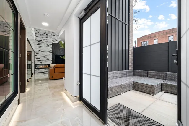 a view of a living room and balcony