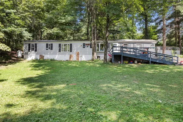 a view of a house with a back yard