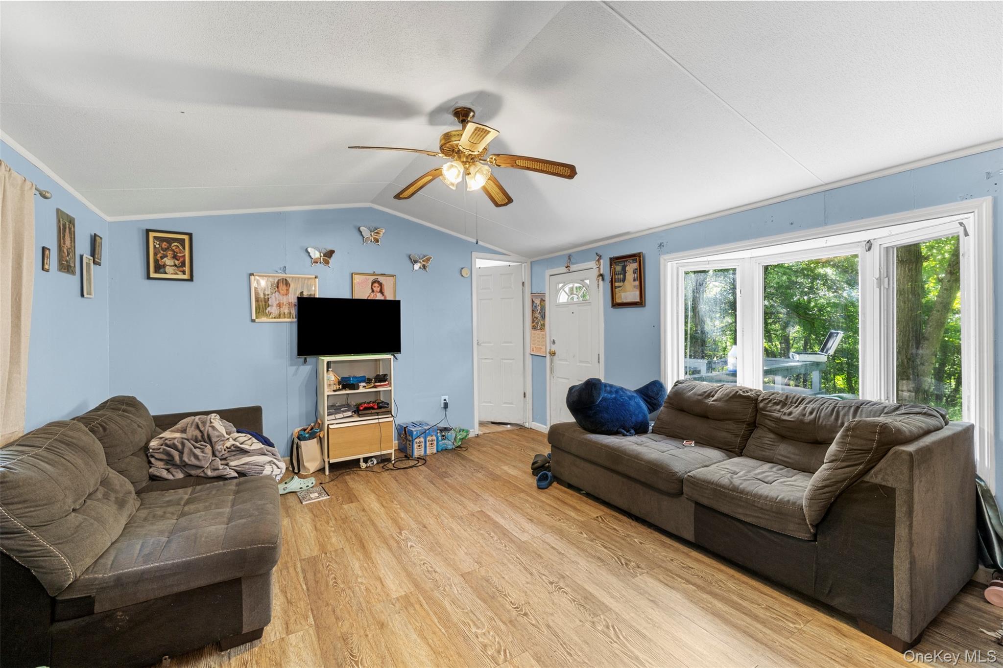 172 Orange Lake Road Walden, NY 12586 - Photo 11 of 22 a living room with furniture and a flat screen tv