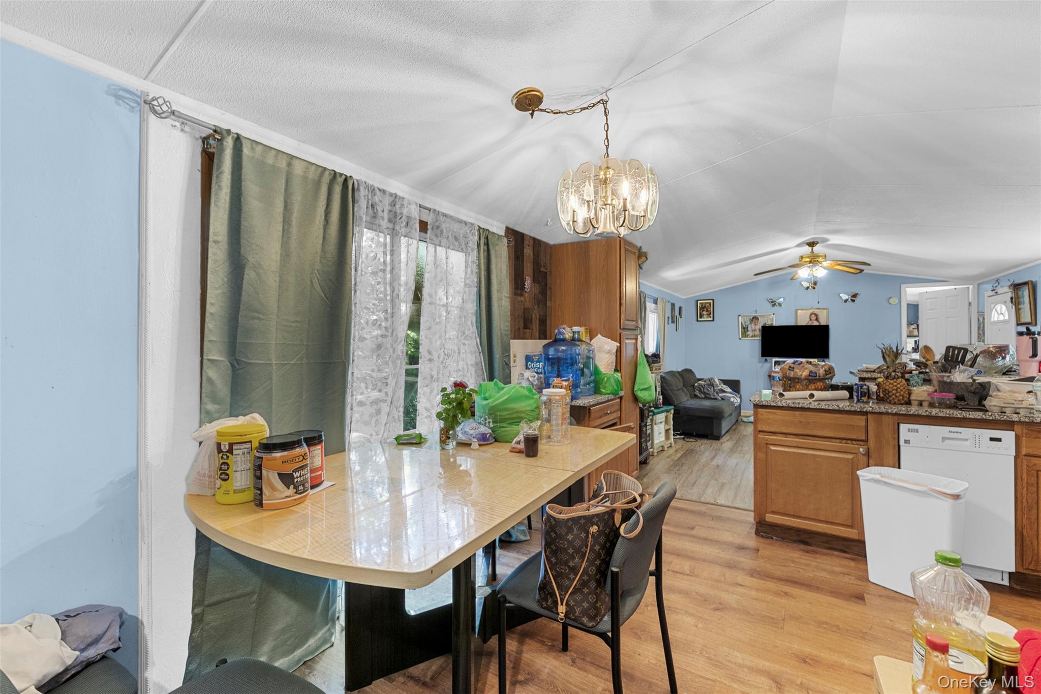 172 Orange Lake Road Walden, NY 12586 - Photo 13 of 22 a view of a dining room with furniture wooden floor and chandelier