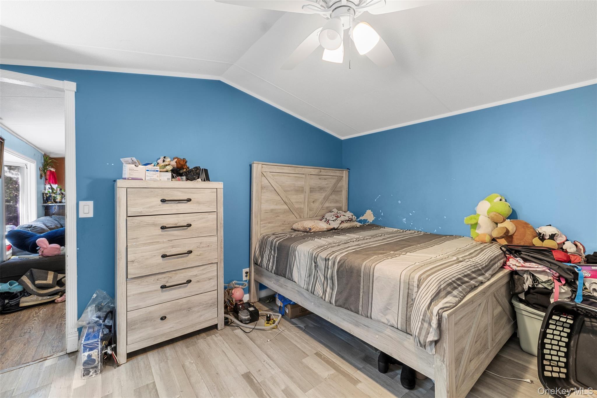 172 Orange Lake Road Walden, NY 12586 - Photo 8 of 22 a bedroom with a bed and a chandelier