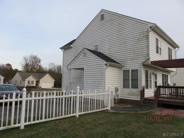 15812 Sandwave Road Chester, VA 23831 - Photo 4 of 45 a view of a house with wooden deck and furniture