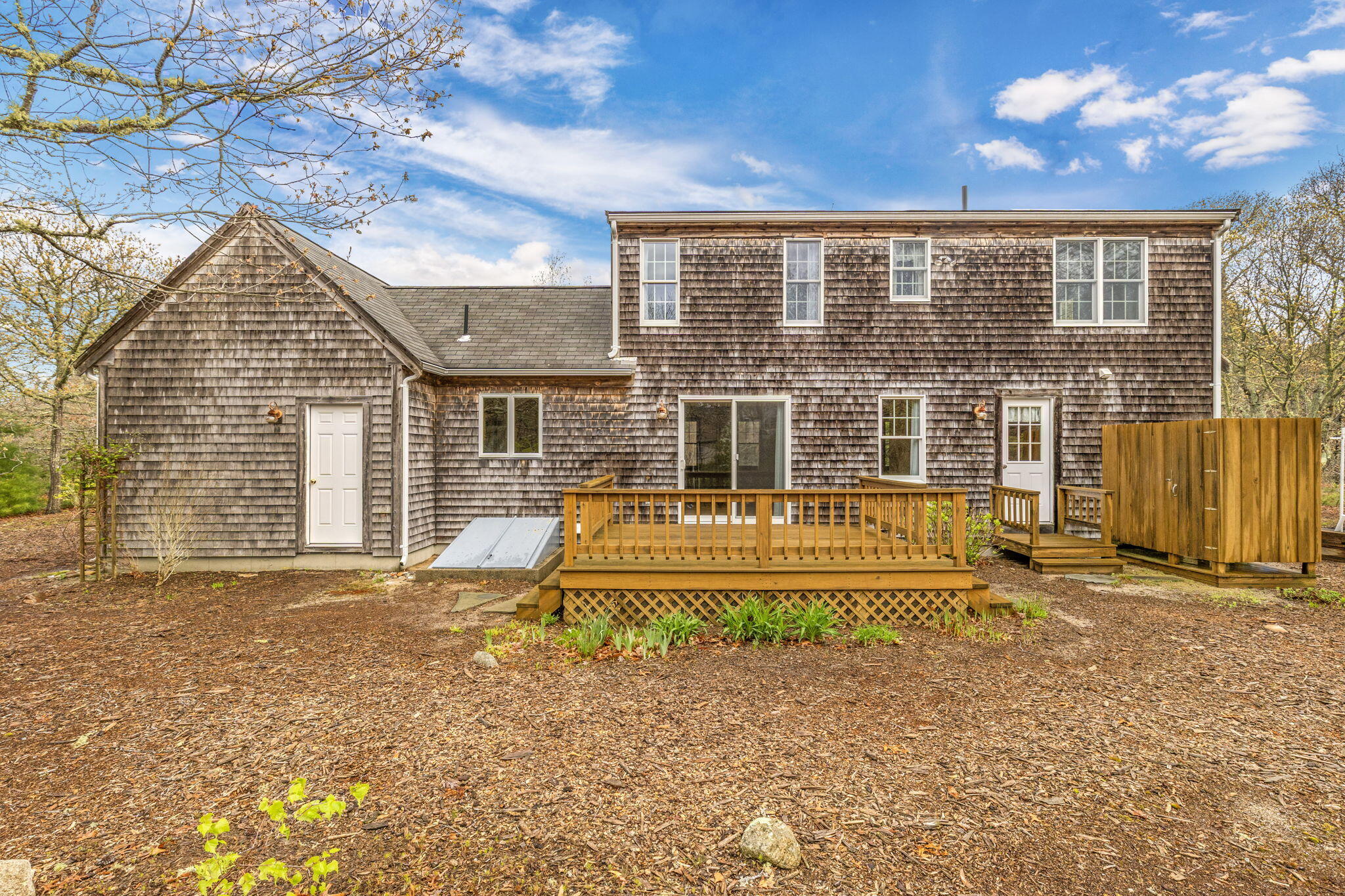65 Whitney Road Eastham, MA 02642 - Photo 8 of 41 a front view of a house with a yard