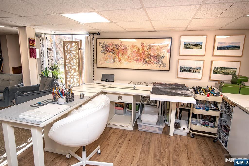 96 Porter Avenue Bergenfield, NJ 07621 - Photo 14 of 18 a dining room with wooden floor and large windows