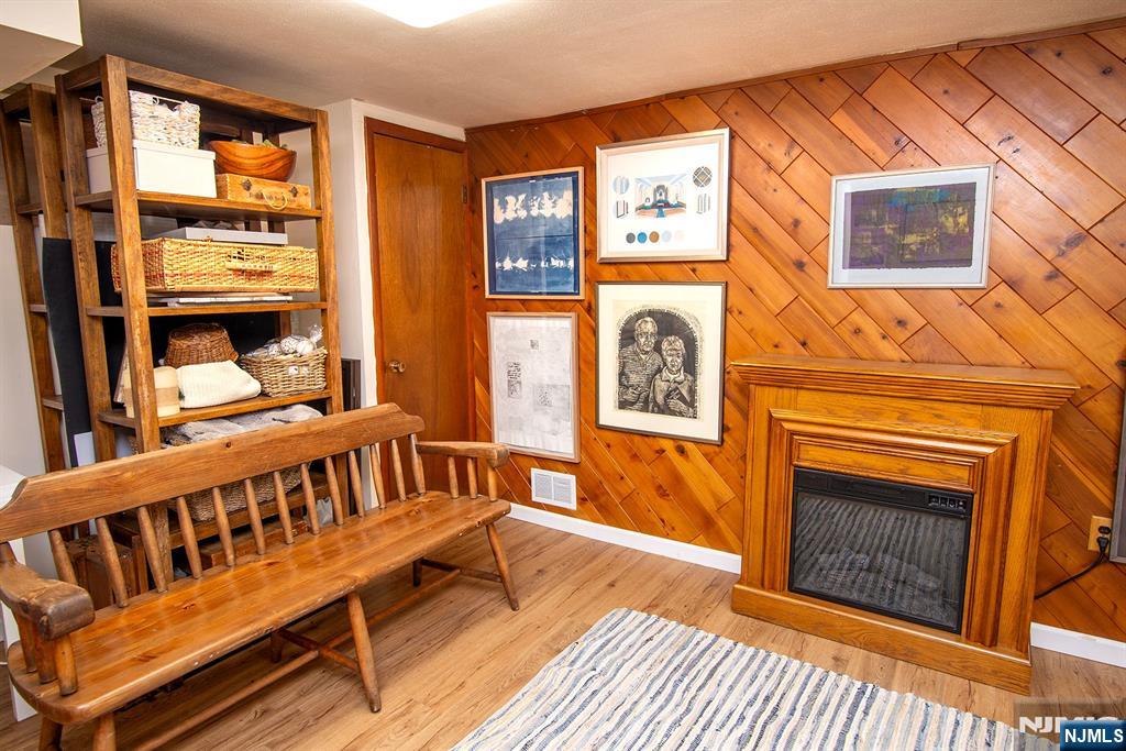 96 Porter Avenue Bergenfield, NJ 07621 - Photo 15 of 18 a bedroom with furniture and a fireplace