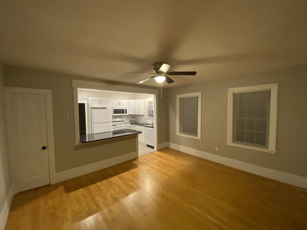 91 Main, Unit 2W Easton, MA 02356 - Photo 2 of 10 a spacious bathroom with a granite countertop sink and a mirror