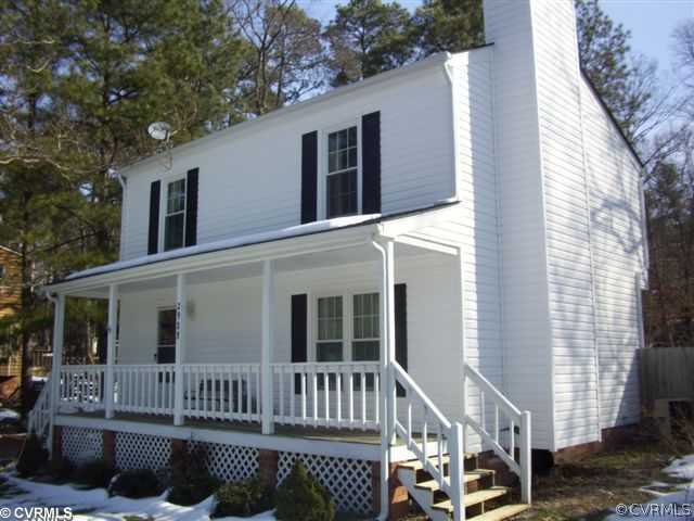 2925 Shiloh Church Road Midlothian, VA 23112 - Photo 1 of 11 a view of a deck with chair and wooden fence