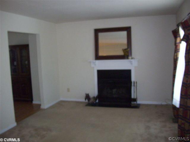 2925 Shiloh Church Road Midlothian, VA 23112 - Photo 4 of 11 a living room with a fireplace