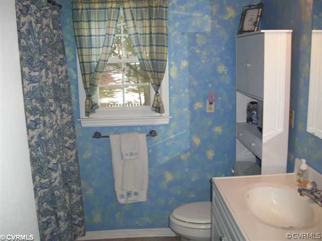 2925 Shiloh Church Road Midlothian, VA 23112 - Photo 5 of 11 a bathroom with a sink toilet and shower