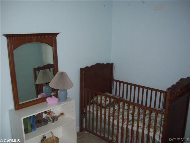 2925 Shiloh Church Road Midlothian, VA 23112 - Photo 9 of 11 a view of a hallway with bed and a dresser