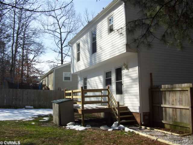 2925 Shiloh Church Road Midlothian, VA 23112 - Photo 10 of 11 a backyard of a house with barbeque oven and seating space