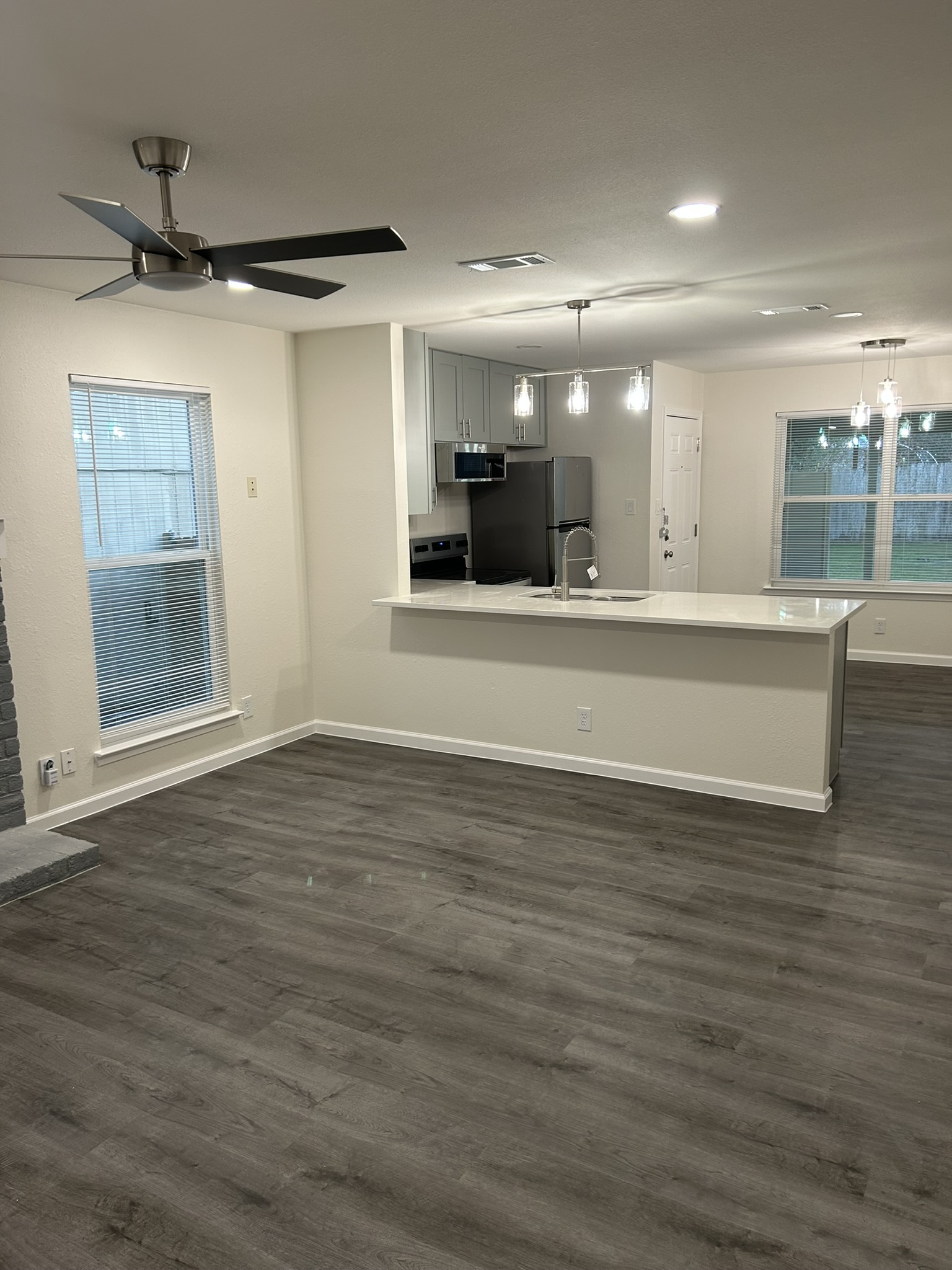 1507 Cinnamon Path, Unit A Austin, TX 78704 - Photo 2 of 8 a view of a room with wooden floor and a window