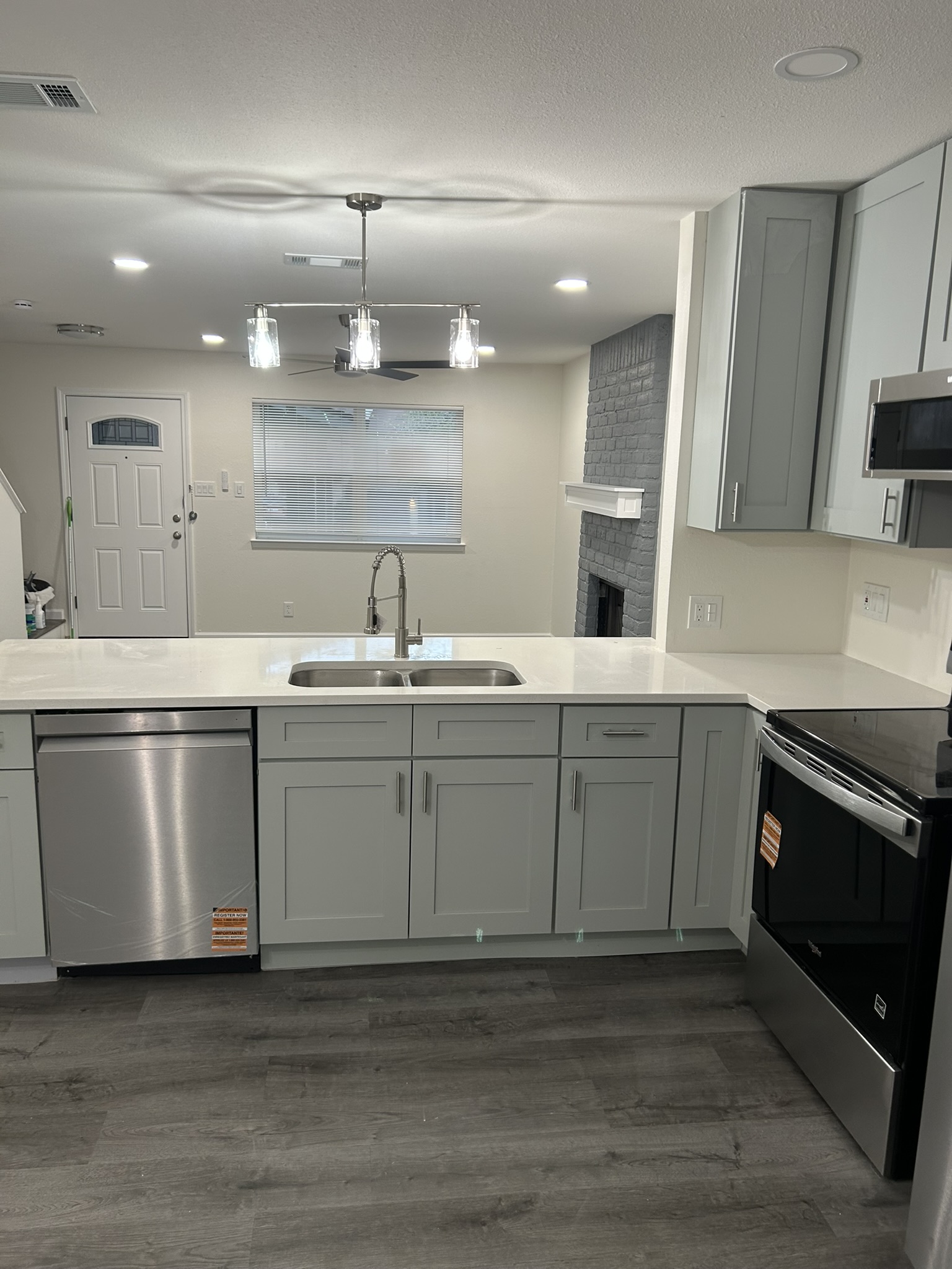 1507 Cinnamon Path, Unit A Austin, TX 78704 - Photo 4 of 8 a kitchen with a sink stainless steel appliances and cabinets