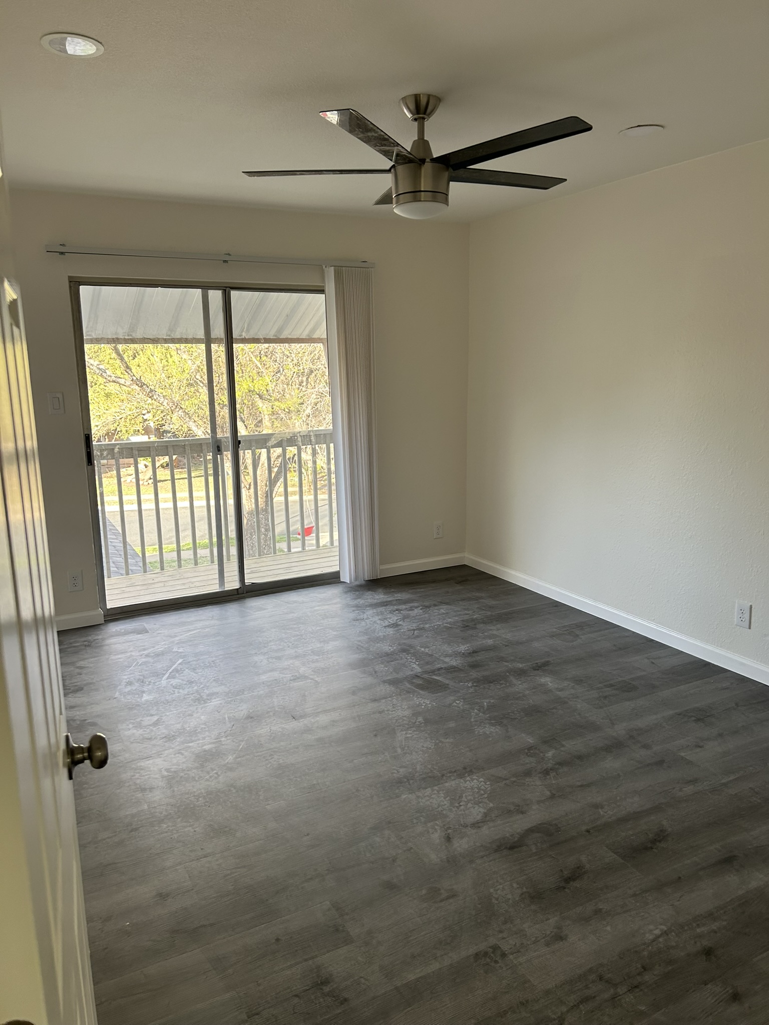 1507 Cinnamon Path, Unit A Austin, TX 78704 - Photo 6 of 8 a view of an empty room with a window