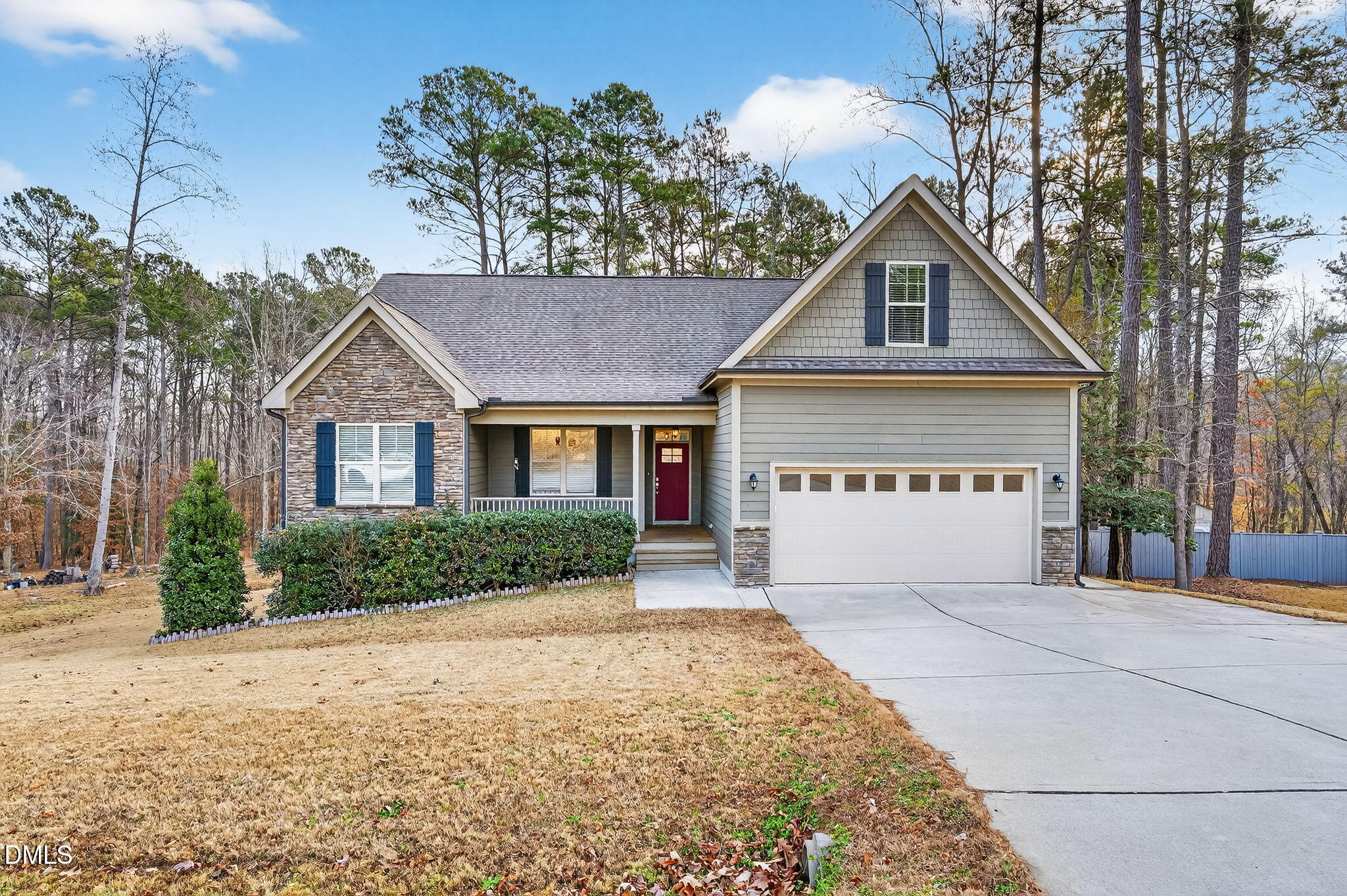 5441 Fantasy Moth Drive Garner, NC 27529 - Photo 1 of 55 a front view of a house with a garden and trees