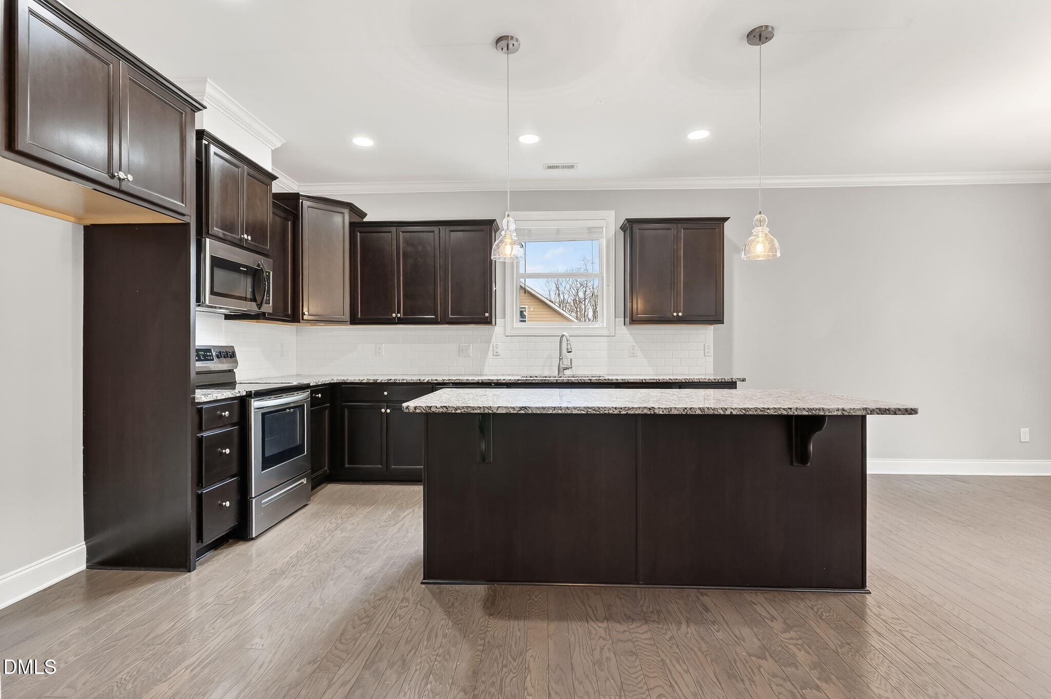 5441 Fantasy Moth Drive Garner, NC 27529 - Photo 11 of 55 a kitchen with stainless steel appliances granite countertop a refrigerator and a stove
