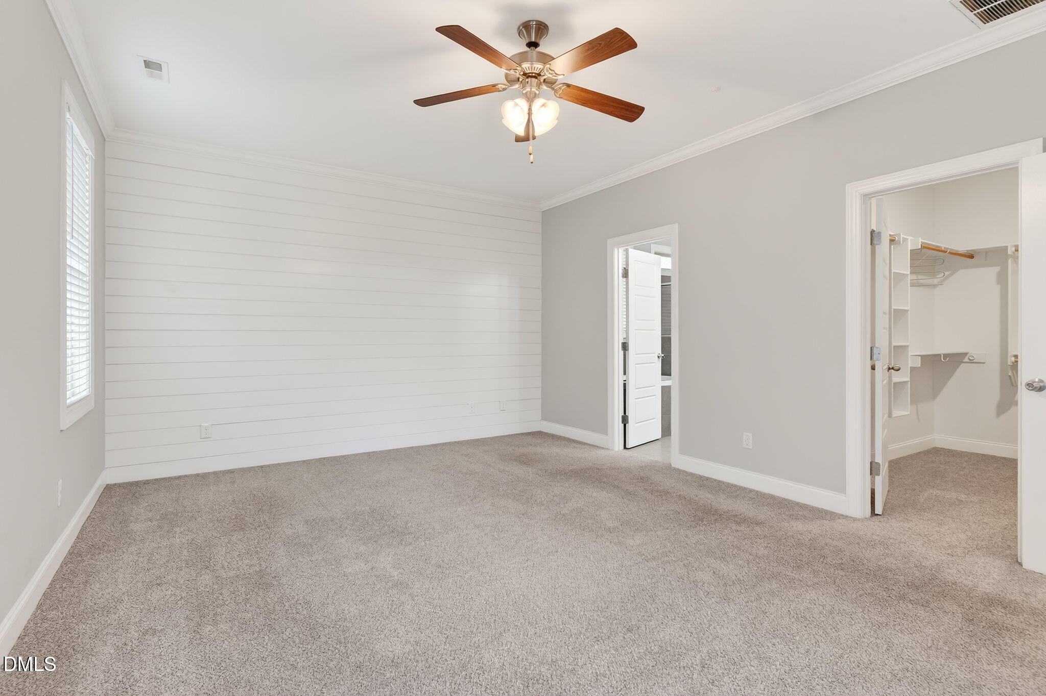 5441 Fantasy Moth Drive Garner, NC 27529 - Photo 19 of 55 an empty room with closet and a ceiling fan